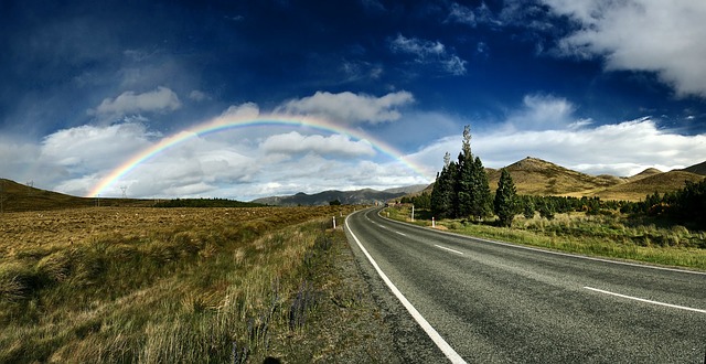 Country road with rainbow