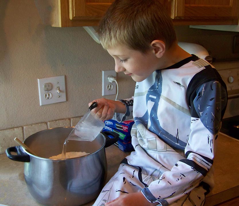 Perfect playdough recipe - adding the wet ingredients. Pouring in the water