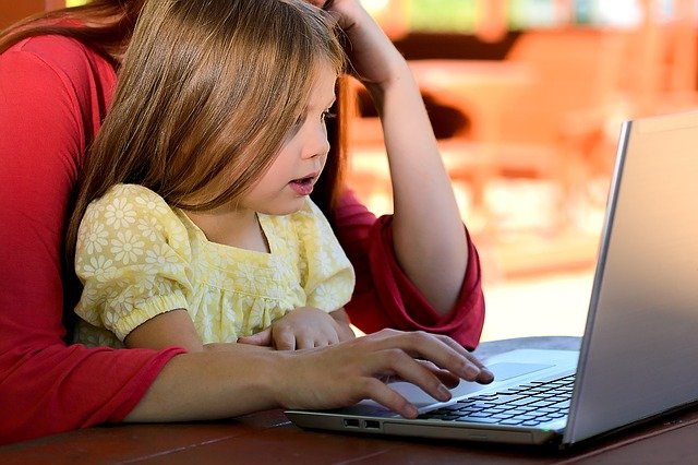 Mother and daughter perusing the internet